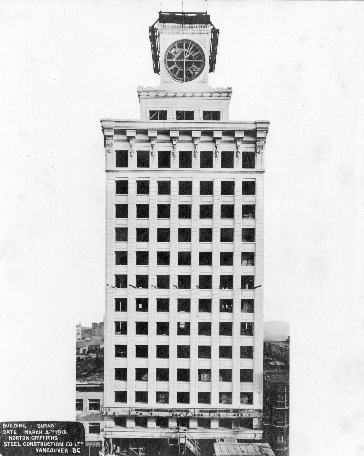 Vancouver Block under construction in March 1912 showing the nearly complete clock tower and facade